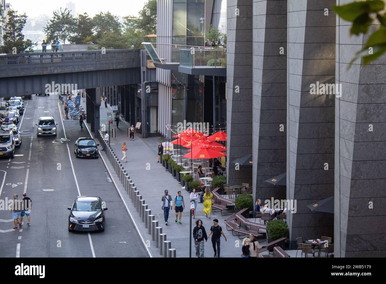 A busy city street teeming with pedestrians and cyclists Stock Photo ...