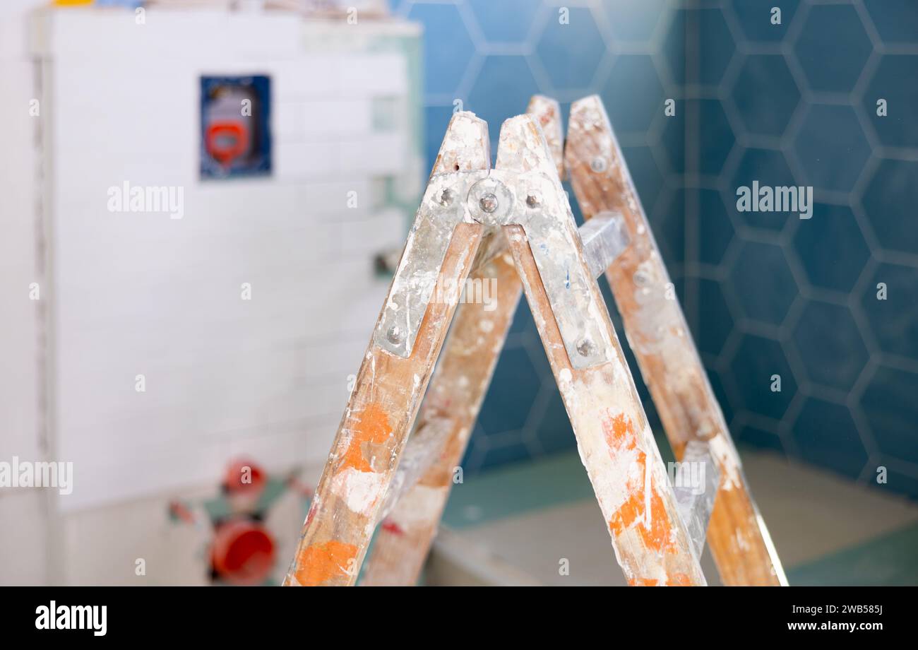 Stepladder in empty bathroom during improvement works Stock Photo