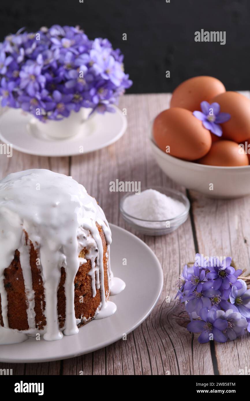 This photo depicts a homemade Easter cake, known as kulich, adorned with icing. Rooted in Christianity and spring culture, the baked delicacy symboliz Stock Photo