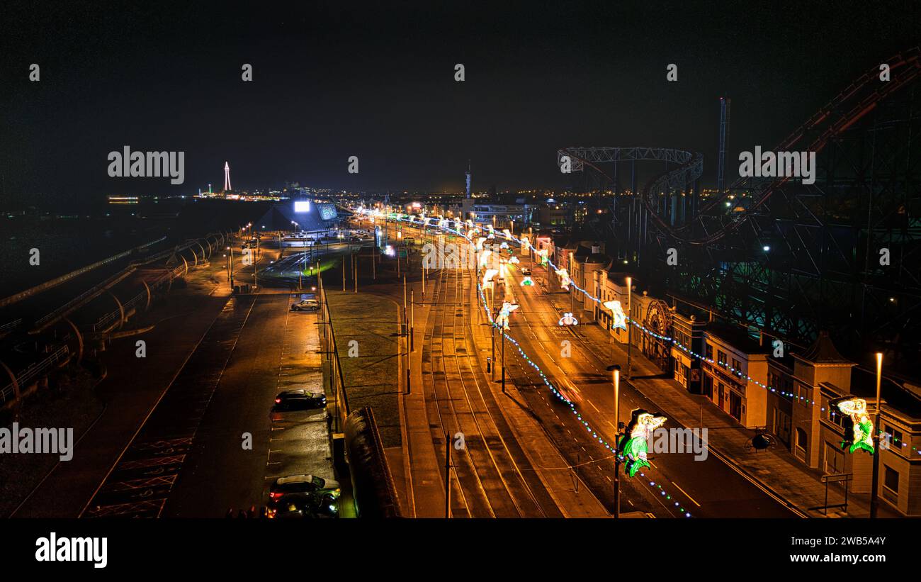 Night cityscape with illuminated streets and traffic lights, showcasing ...