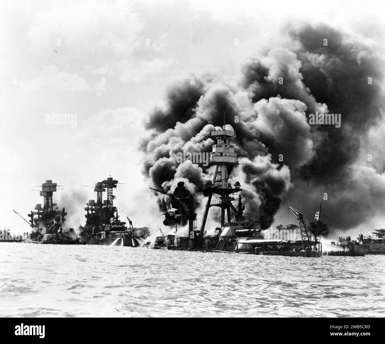 Attack on Pearl Harbor, Aftermath of a Japanese attack on three stricken U.S. battleships,: 1941 Stock Photo