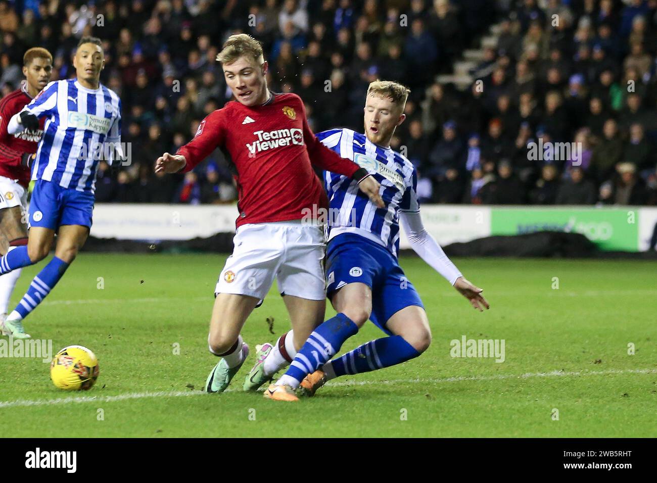 Wigan, UK. 08th Jan, 2024. Liam Morrison of Wigan Athletic (r) and