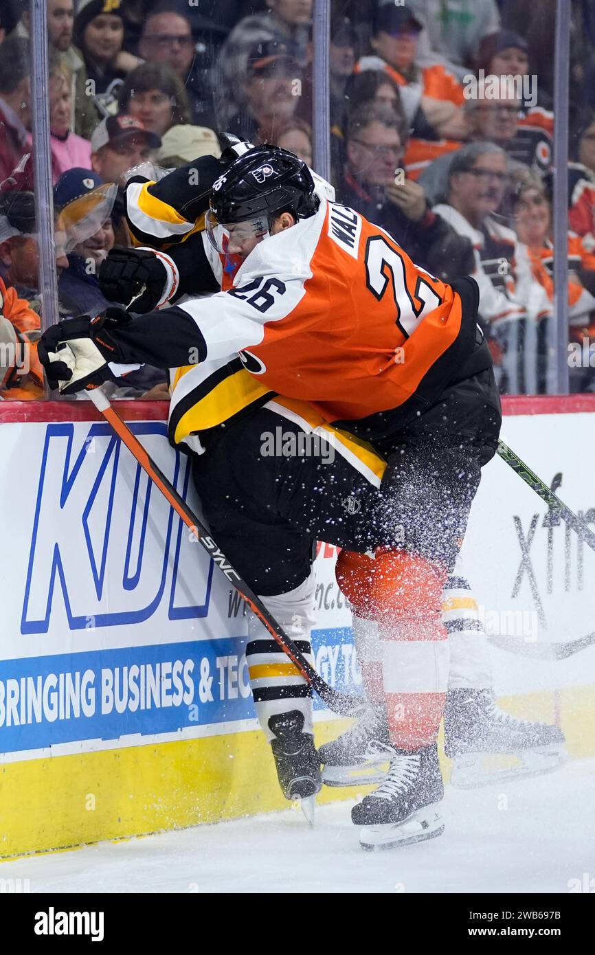 Philadelphia Flyers' Sean Walker, right, collides with Pittsburgh