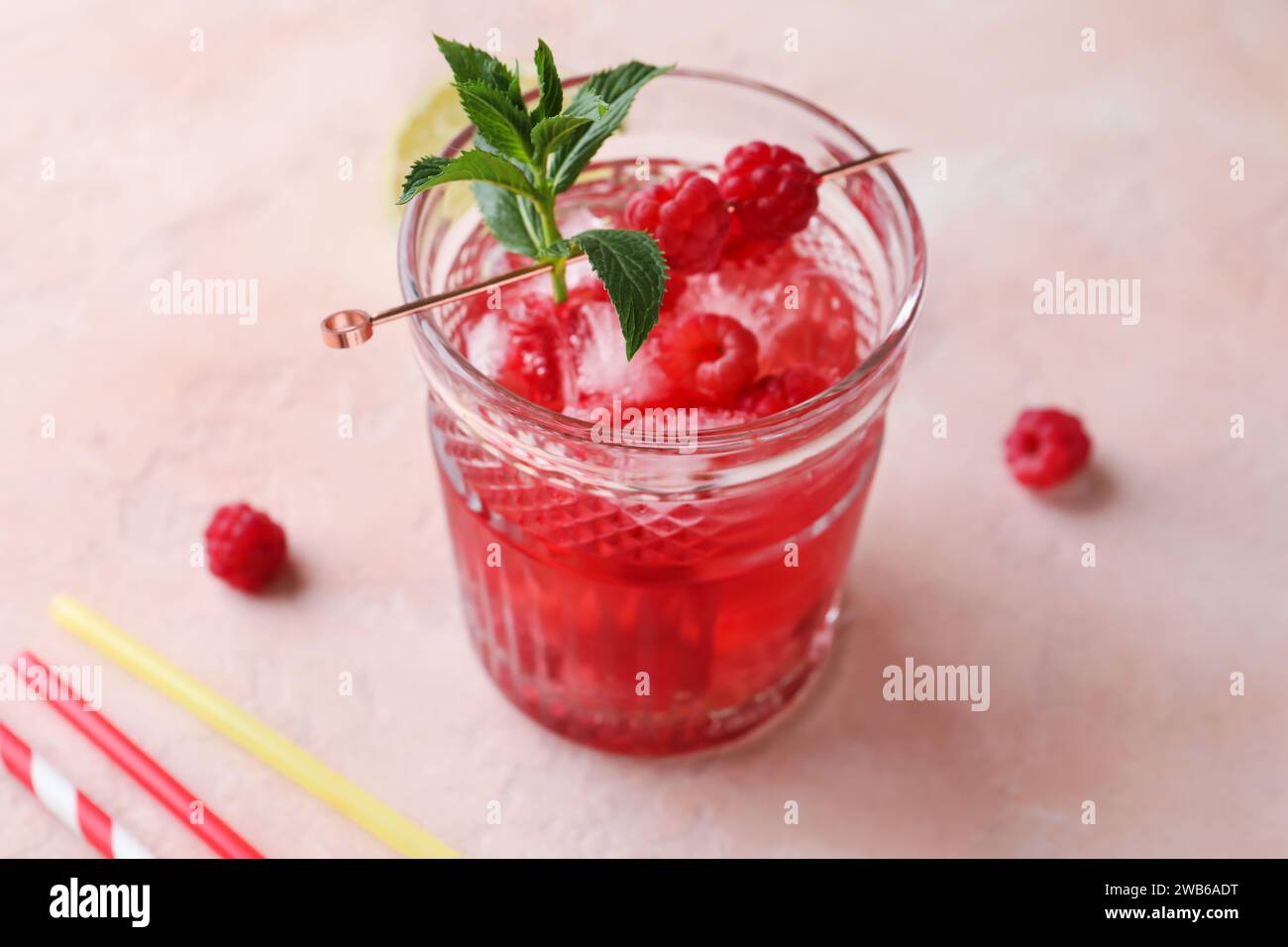 Glass of fresh raspberry lemonade with mint on pink background Stock ...