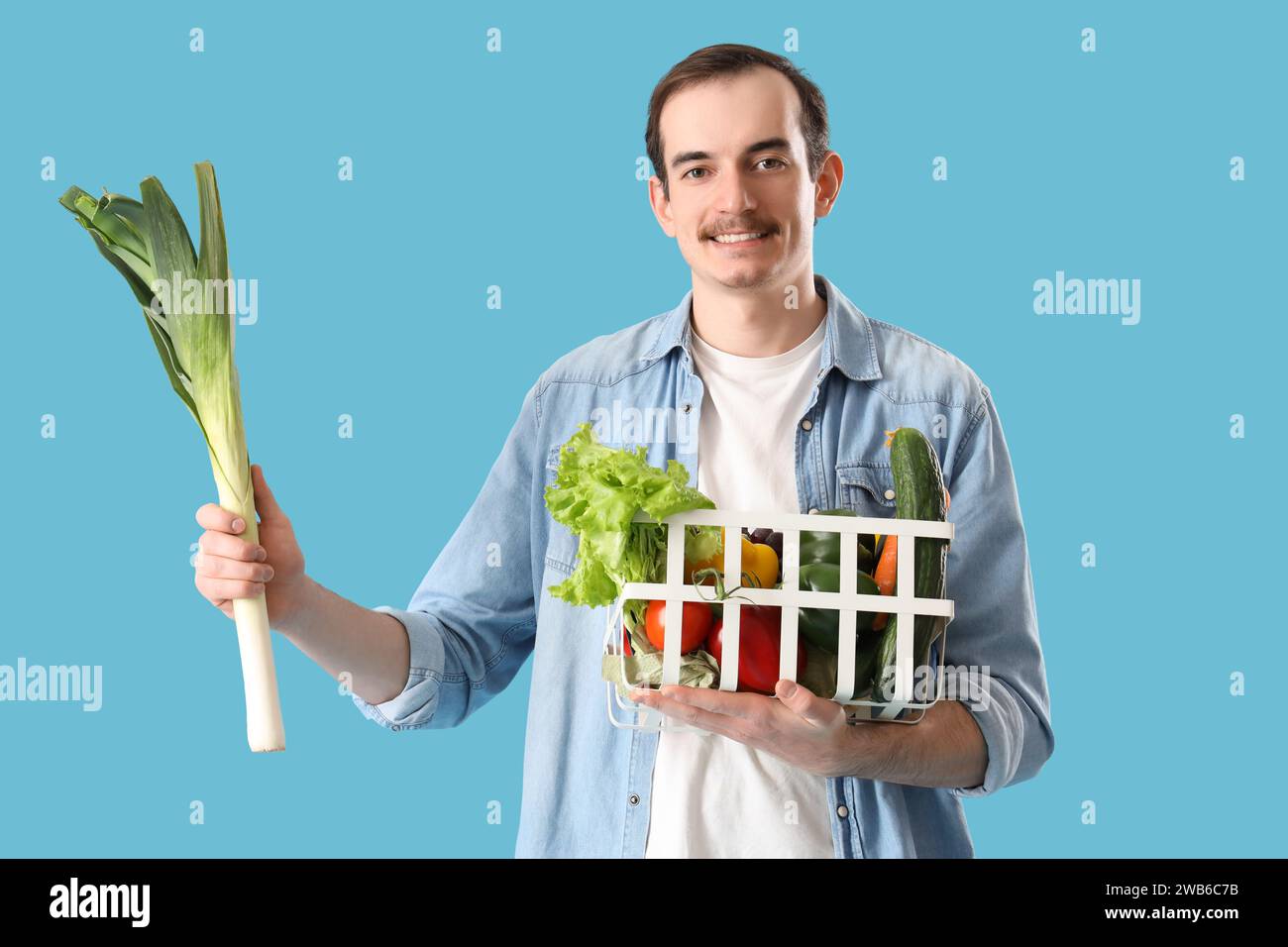 Young man vegetables basket hi-res stock photography and images - Alamy