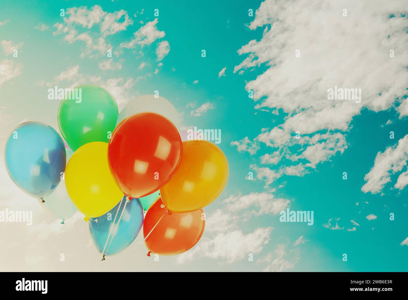Colorful balloons flying in blue sky with clouds. Space for text Stock ...