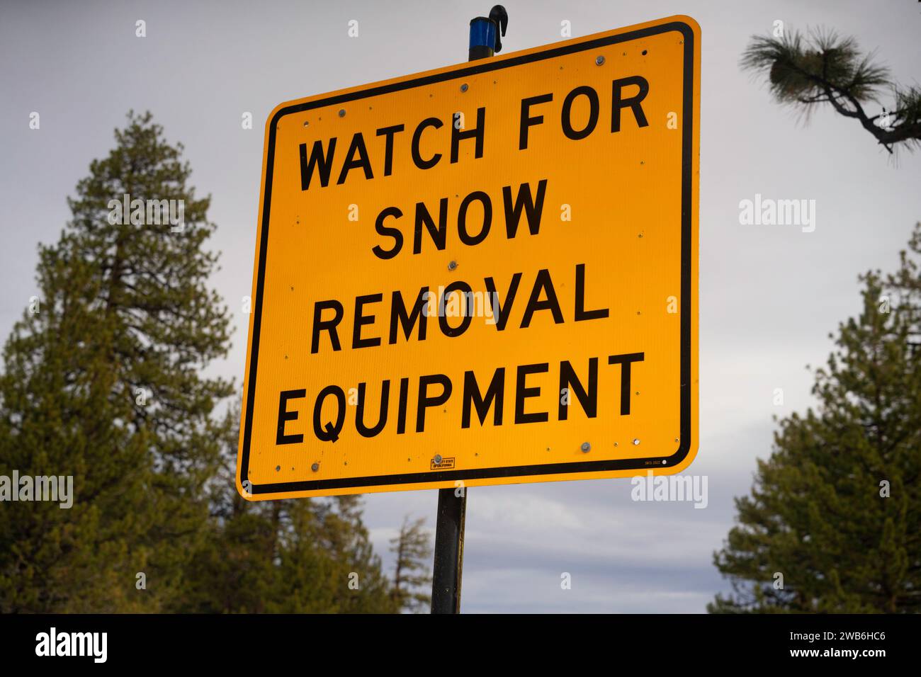 Highway Sign in Sierra Nevada Mountains Watch for Snow Removal