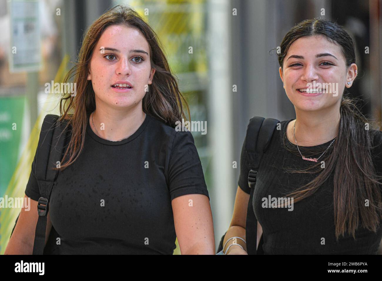 Italian young women walking in Via Ugo Bassi, Bologna, Italy. Stock Photo