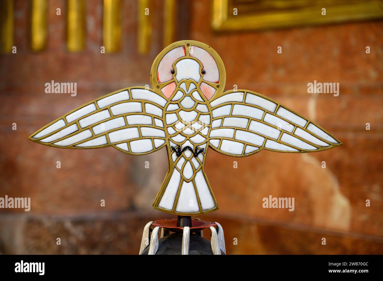 A dove, the symbol of the Holy Spirit, on the cover of a baptismal font in Church of Saint Giles (Kirche St. Ägyd) in Gumpendorf, Vienna. Stock Photo