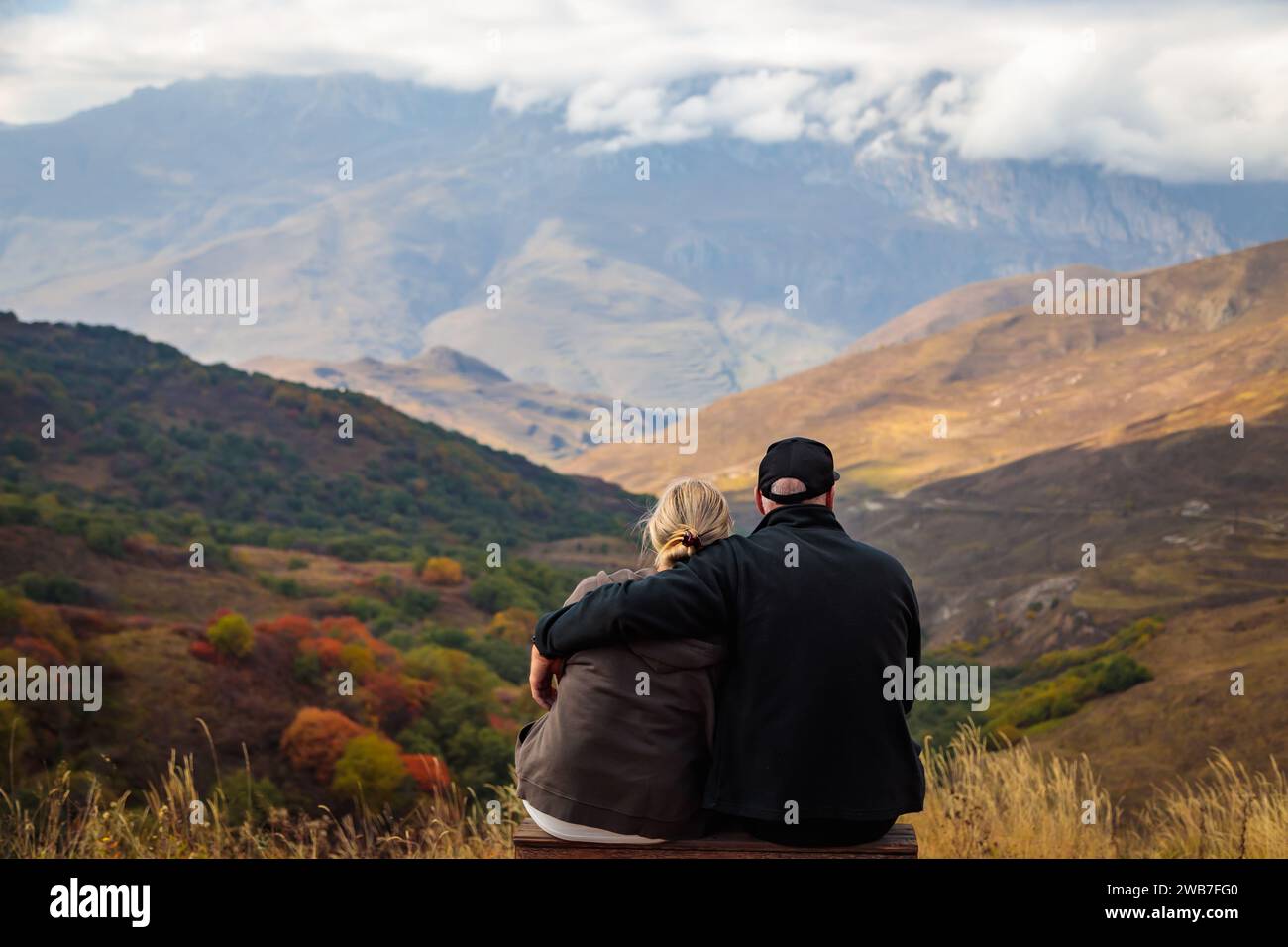 Loving couple admiring sunset hi-res stock photography and images - Alamy