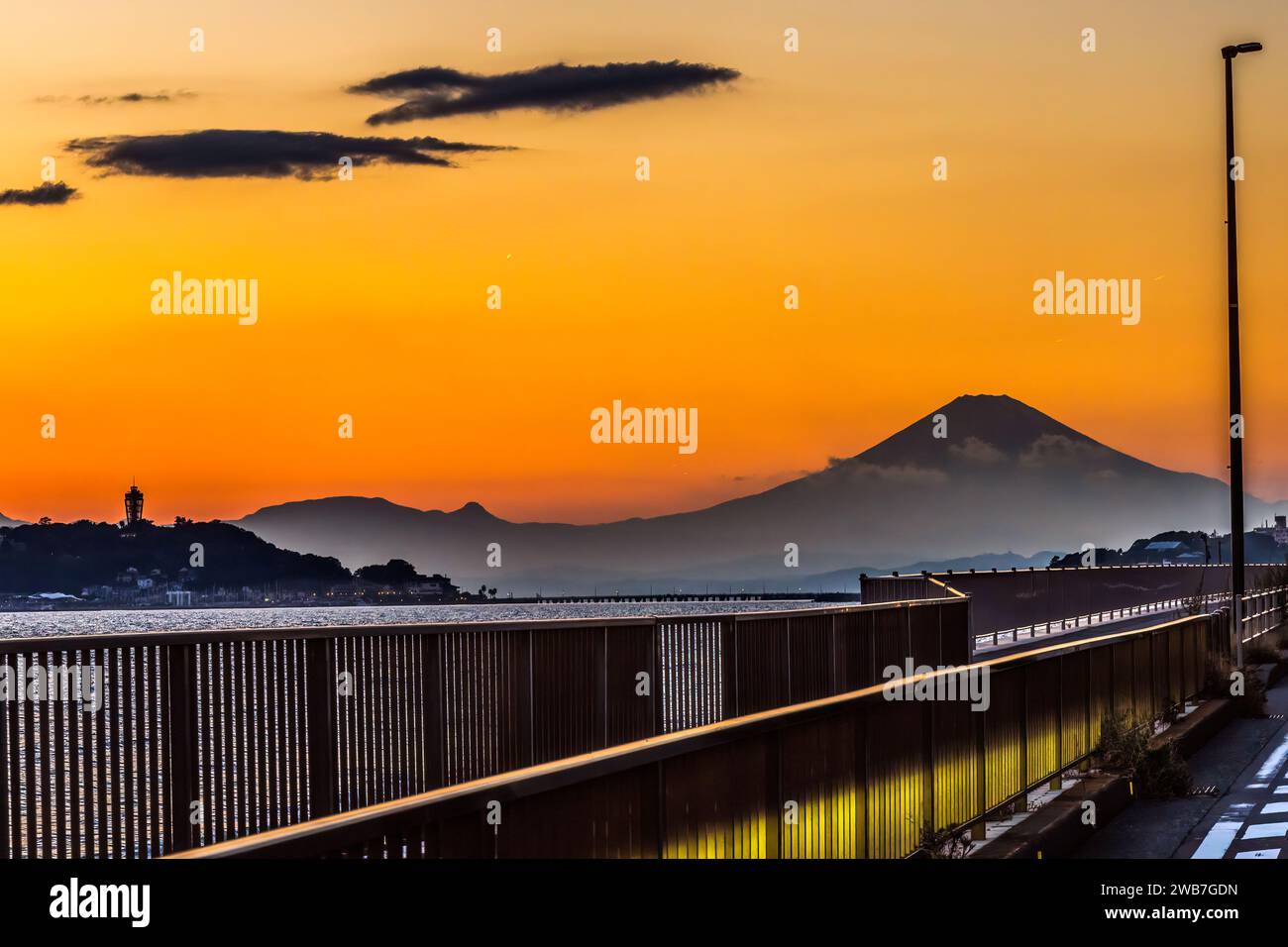 Colorful Sunset Highway Fence Mt Fuji Sagami Bay Pacific Ocean Kamakura Kanagawa Japan. Stock Photo