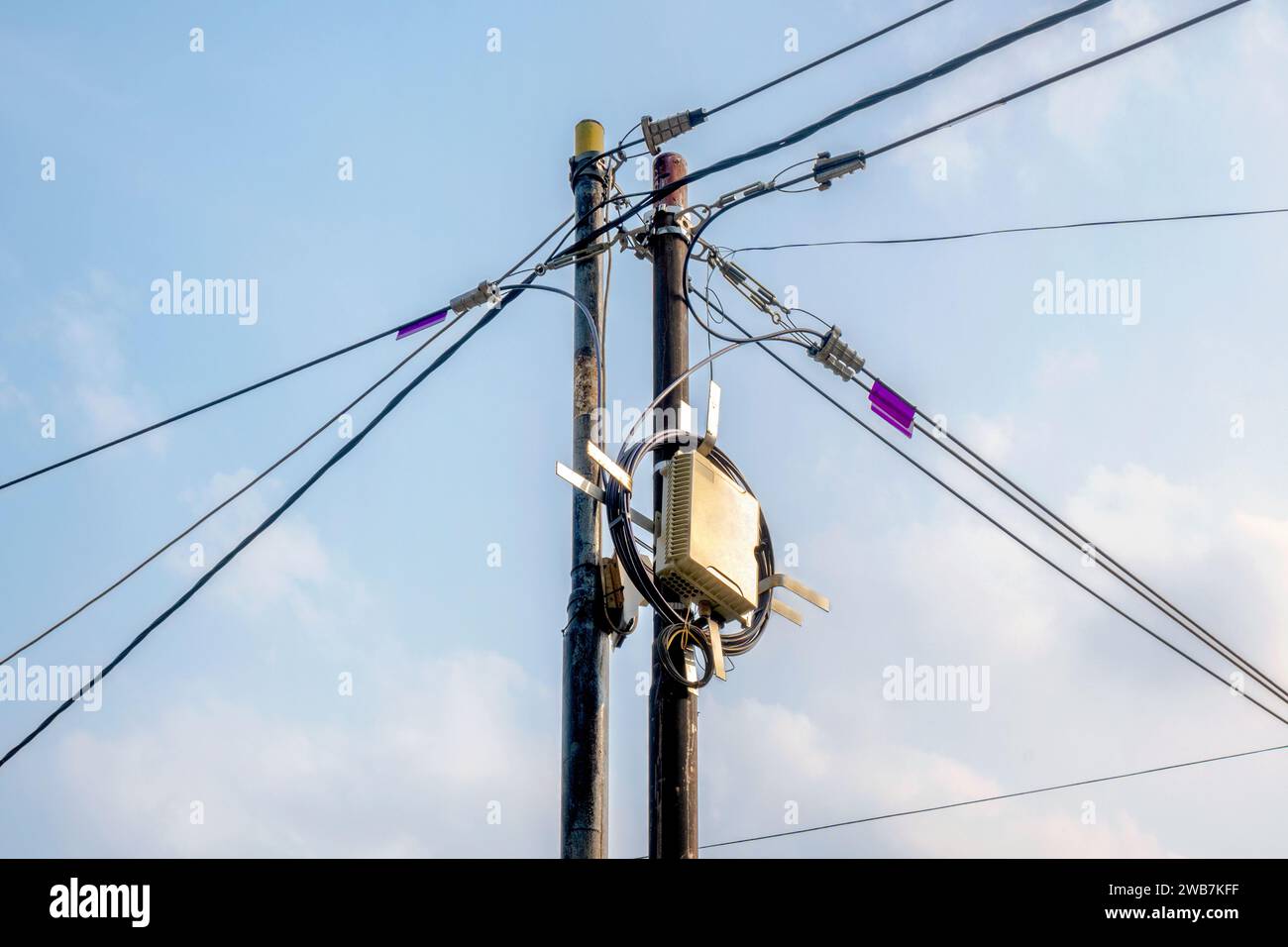 High voltage power lines tower with a blue sky background Stock Photo ...
