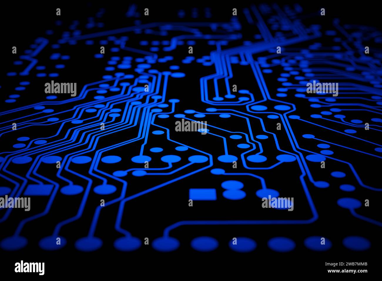 A close-up of a circuit board illuminated with a bright glow Stock ...