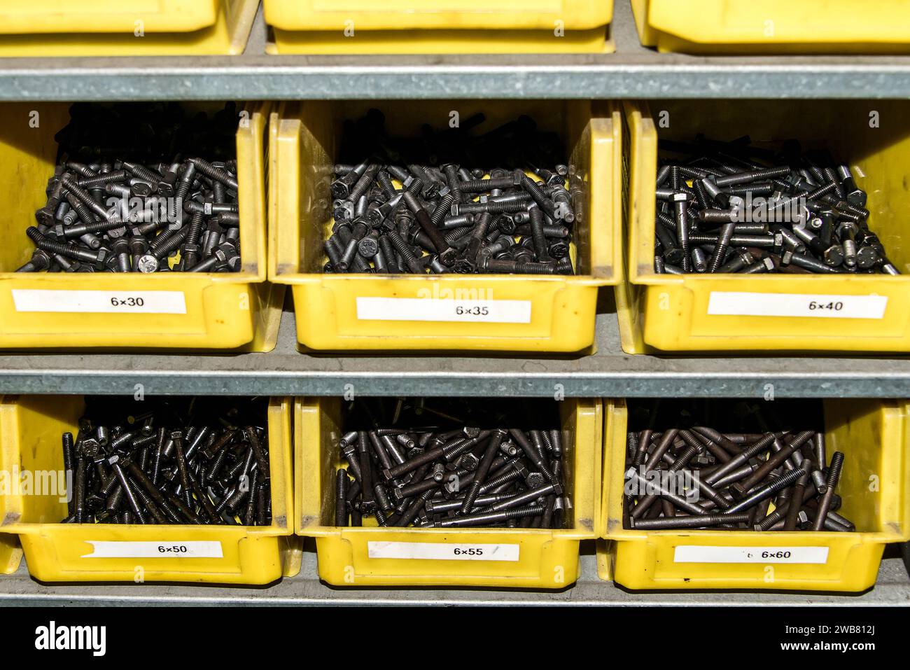 Yellow box with small construction storage compartments filled with