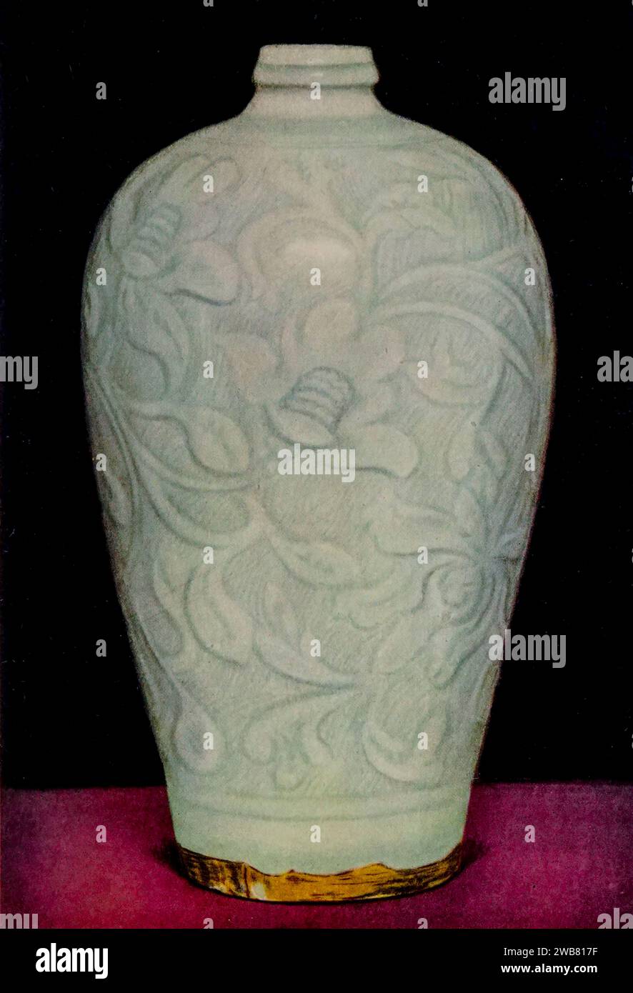 Vase of porcelain with carved designs and bluish-white glaze Ju type. Sung dynasty, H. 247mm from Chinese art : one hundred plates in colour reproducing pottery & porcelain of all periods, jades, lacquer, paintings, bronzes, furniture, etc., etc. by   Hobson, R. L. (Robert Lockhart), 1872-1941 Publication date 1927 Publisher New York : The Macmillan Company Stock Photo