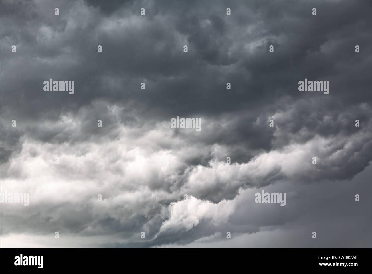 Dark and Dramatic Storm Clouds Area. Background Great For Any Use Stock Photo