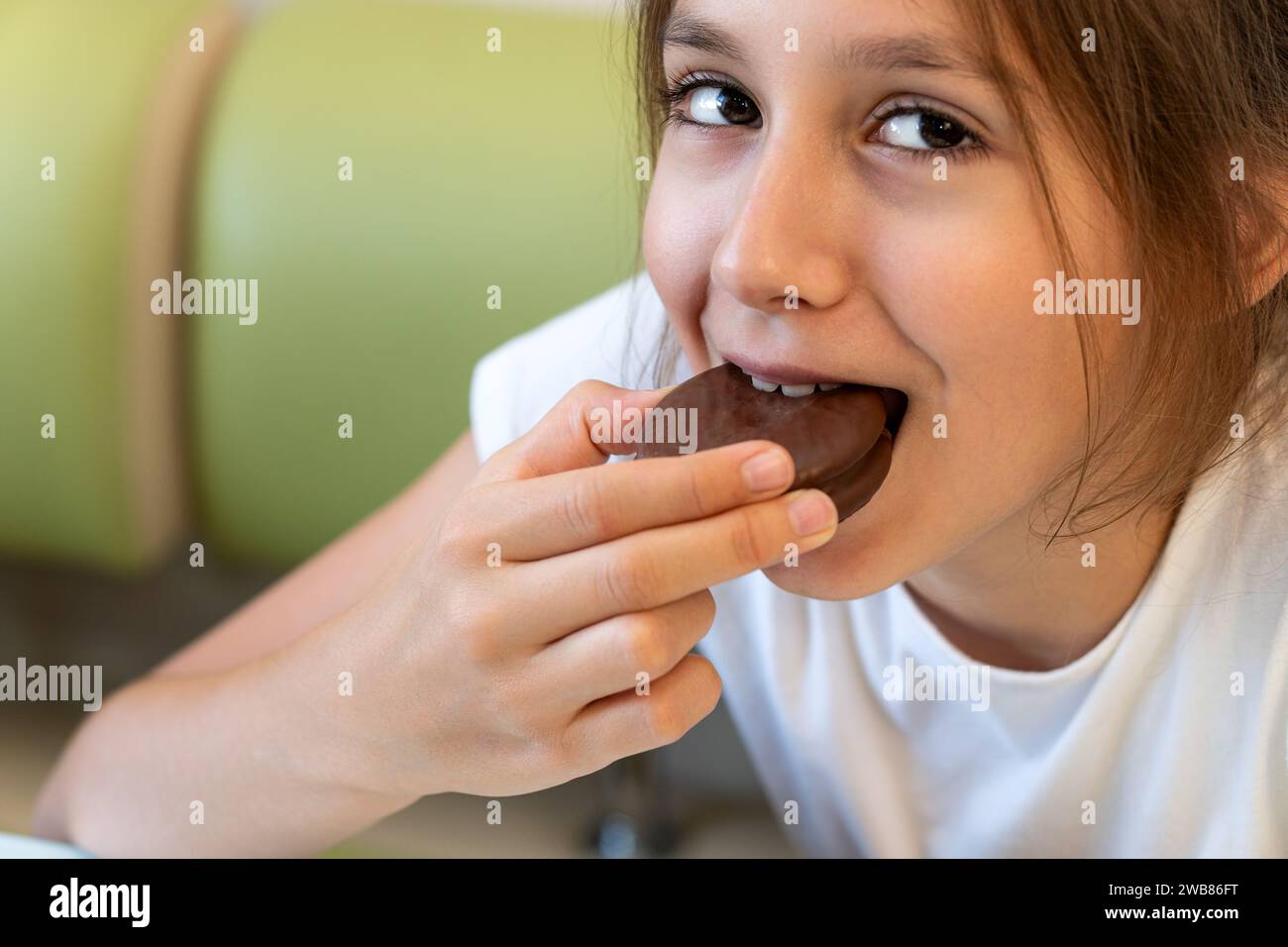 Close up shot of choco pie is eaten by teenage girl. Looks delicious