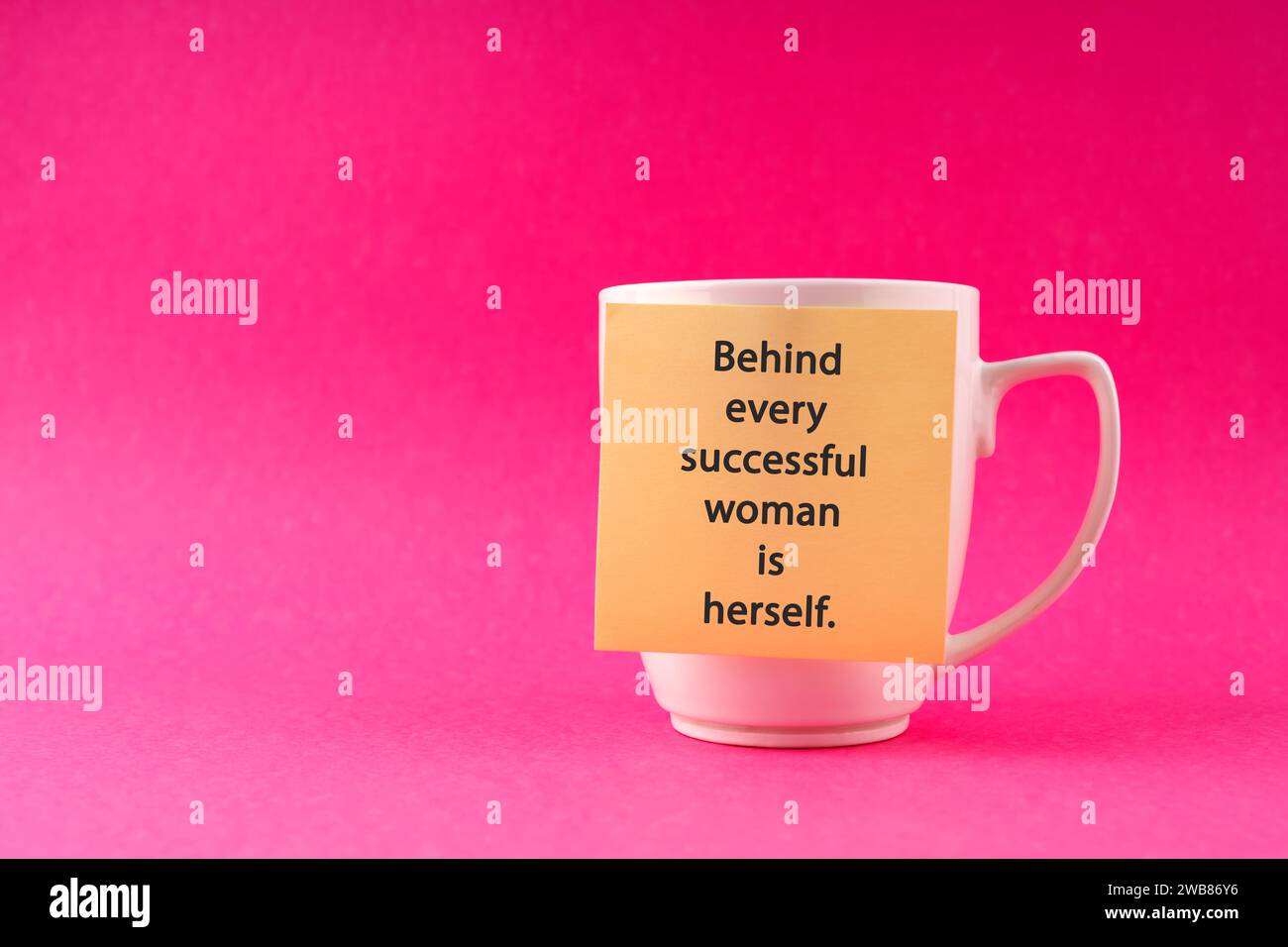 Inspirational quotes on adhesive note stick on a cup Behind every