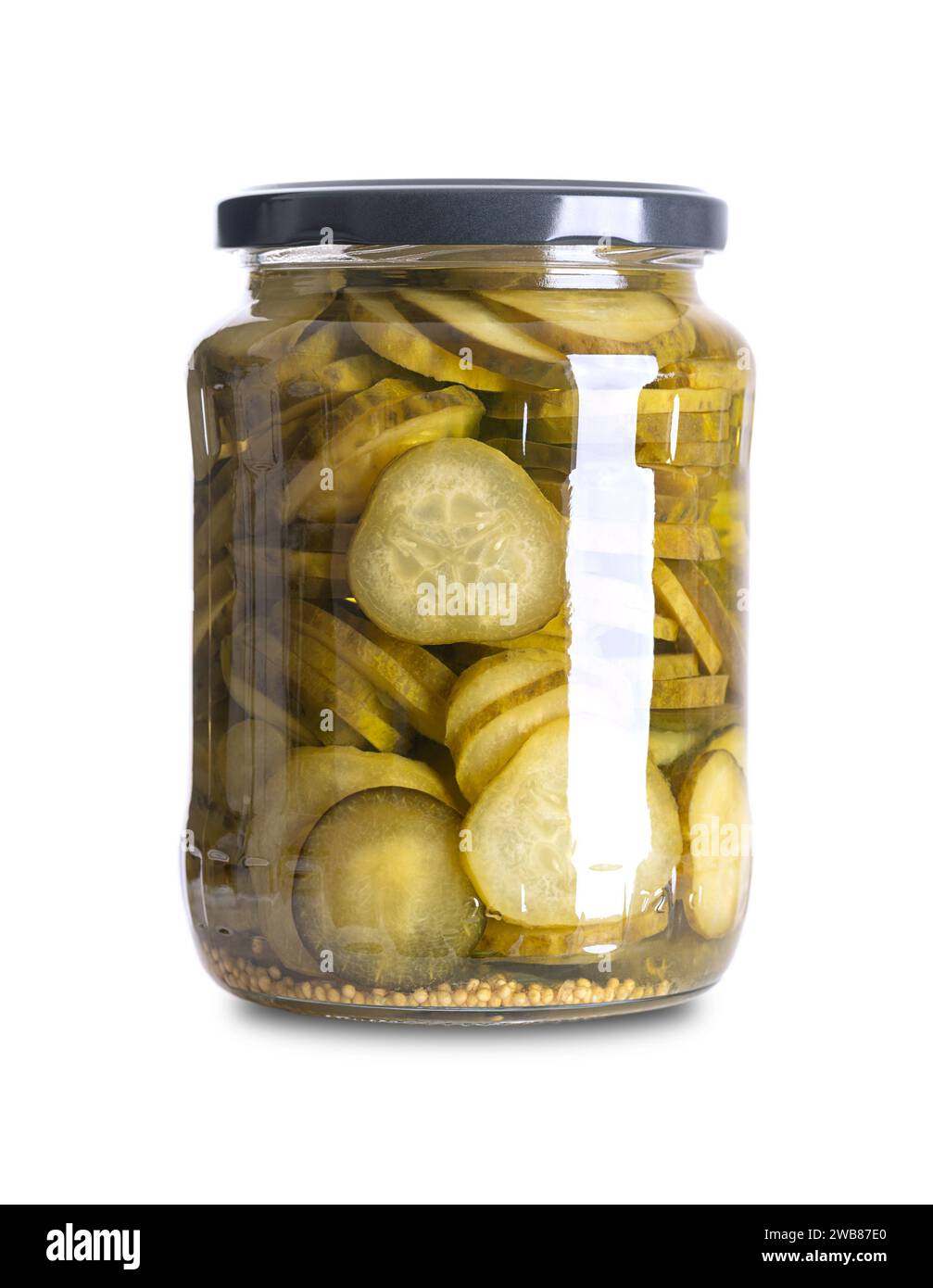 Burger gherkins, pickled cucumber slices, in a glass jar. Crisp round cucumber slices, pasteurized and preserved in a brine. Stock Photo