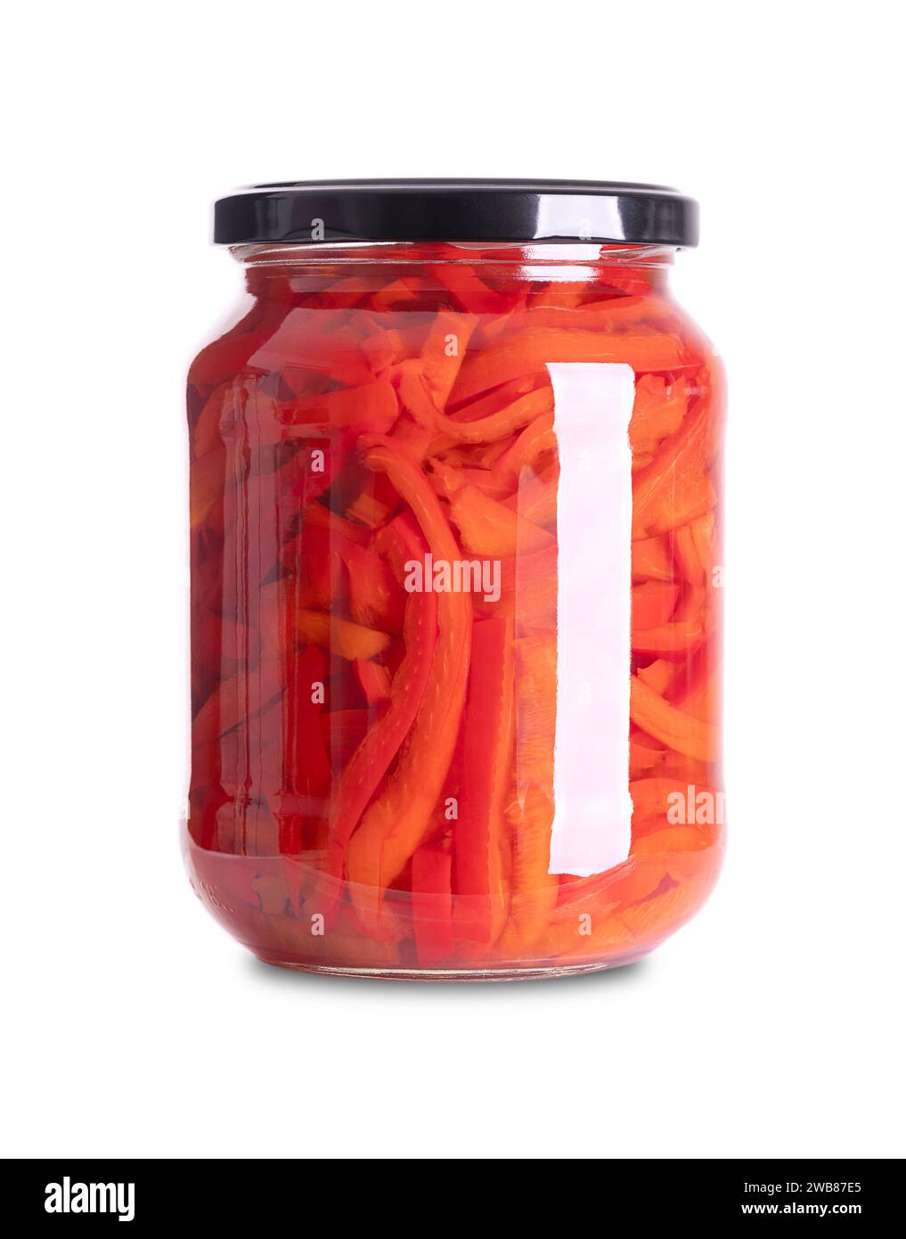 Red bell peppers, pickled in a glass jar. Sweet pepper slices, pasteurized and preserved in a brine of vinegar and salt. Used as salad or side dish. Stock Photo