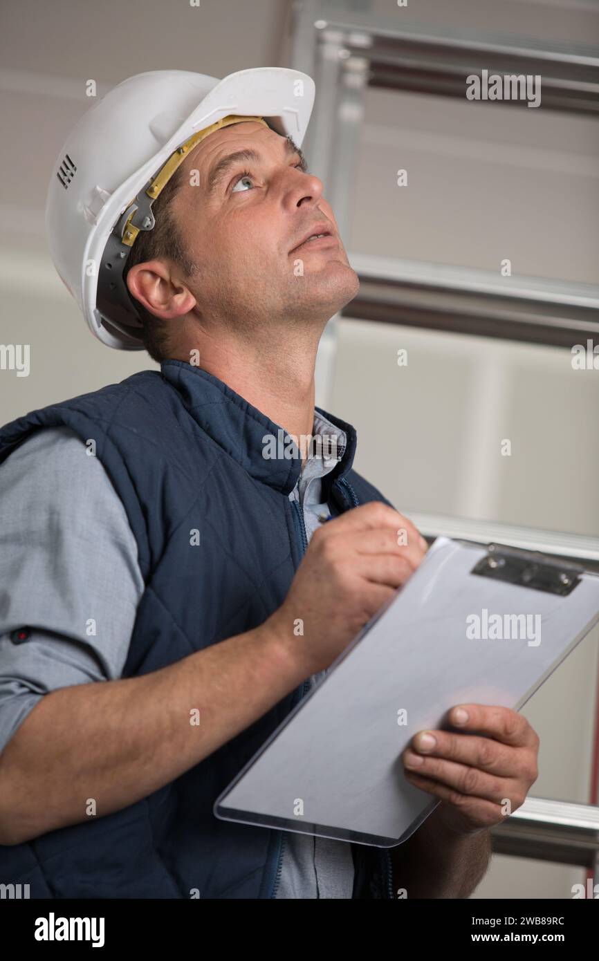 engineer compares quantity of surveying Stock Photo Alamy