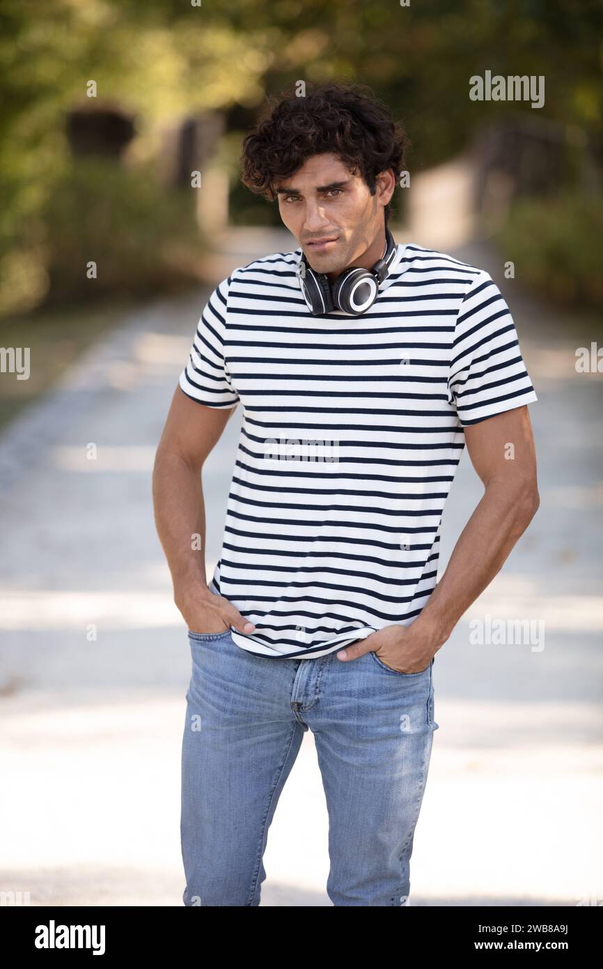 Man in headphones walks hi-res stock photography and images - Alamy