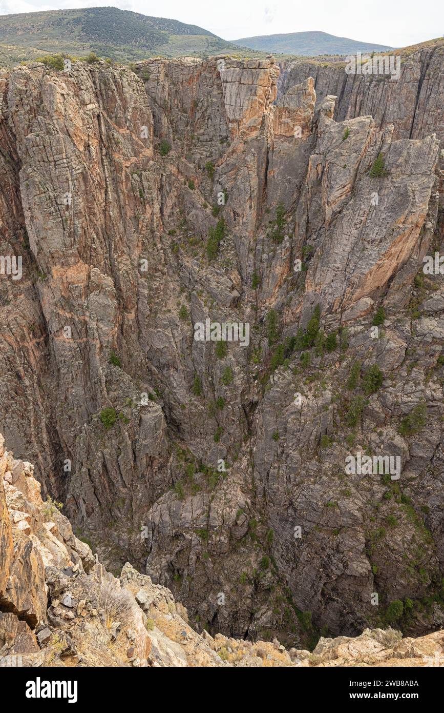 Deep gorges in the north rim of the Black Canyon of the Gunnison at Devil's Lookout on the south rim Stock Photo