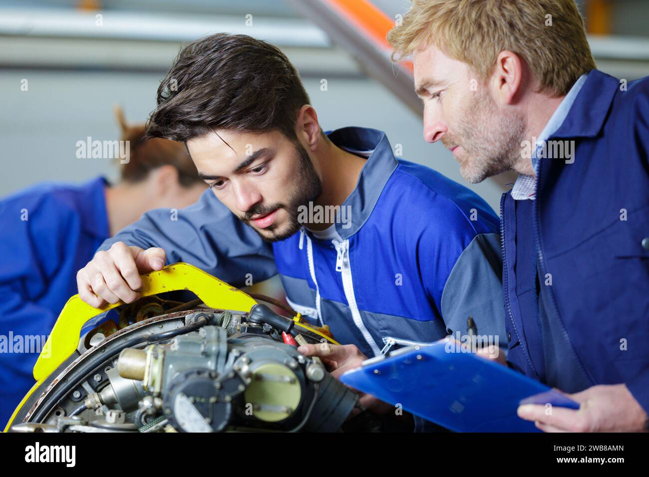 Mechanics working together on hi-res stock photography and images - Alamy