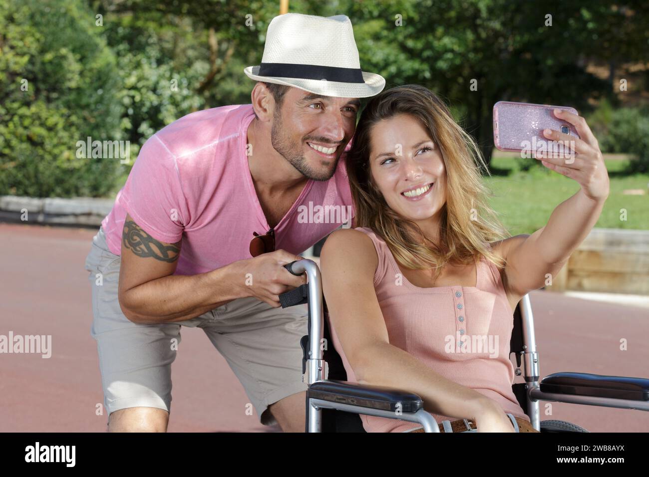 happy young couple in wheelchair doing a selfie Stock Photo - Alamy