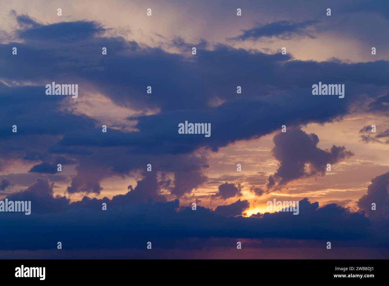 Dark cloudy sky on a sunset, natural background photo Stock Photo - Alamy