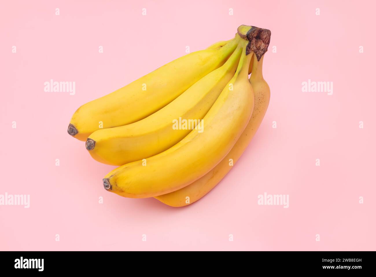 Fresh bananas on pink background. top view Stock Photo