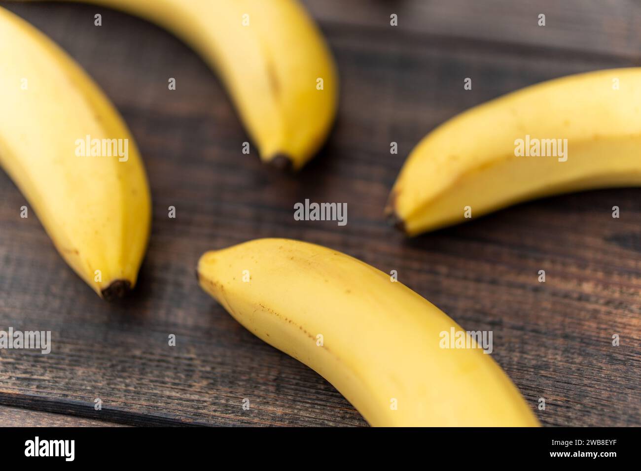 banana on wooden cutting board close up. Healthy natural snack. top view Stock Photo