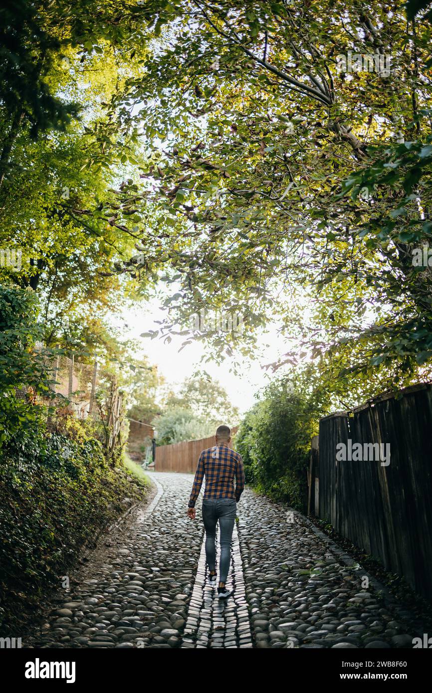 Fashionable man walking outside hi-res stock photography and images - Alamy