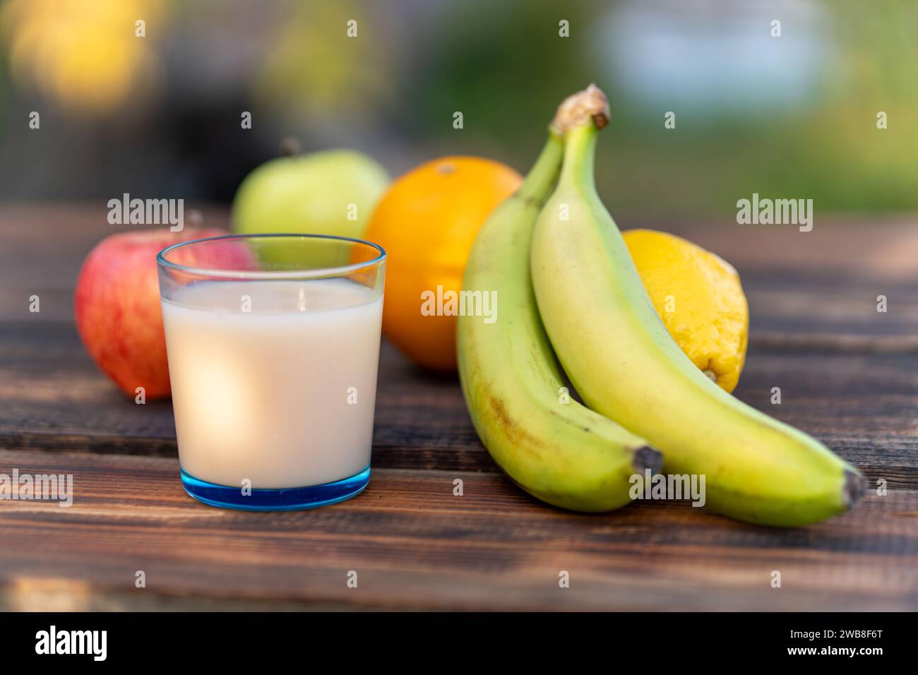 Multifruit juice and fresh fruit on table on kitchen closeup Stock Photo