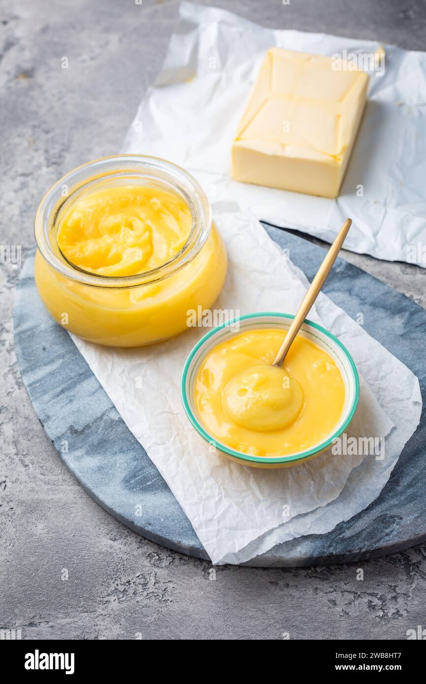 Ghee or clarified butter in jar and bowl. Indian butter Stock Photo - Alamy