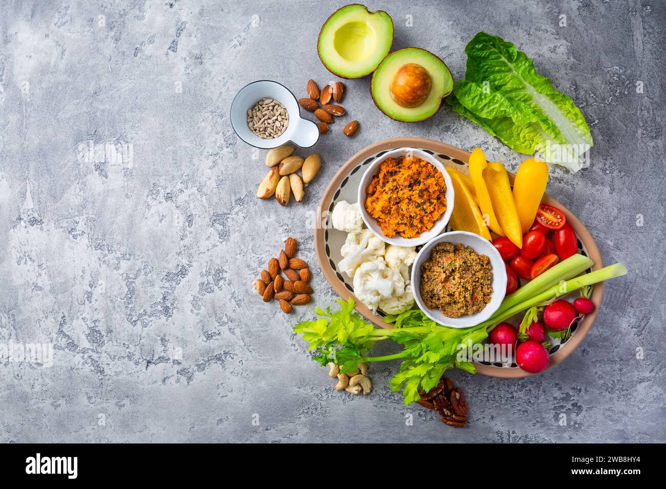Assorted raw snack vegetables with dip sauce, healthy fresh food platter. Stock Photo