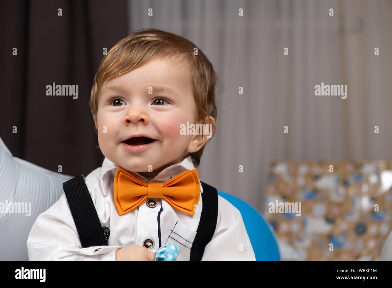 Sincere emotions of happy 11 month old red-haired baby, close-up portrait. Stock Photo