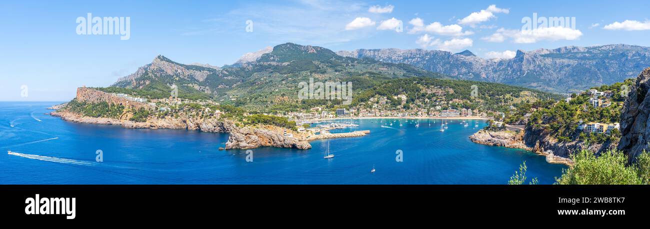 Port de Soller: a stunning snapshot where the UNESCO-protected Tramuntana Mountains meet the tranquil, azure waters of Mallorca's west coast. Stock Photo