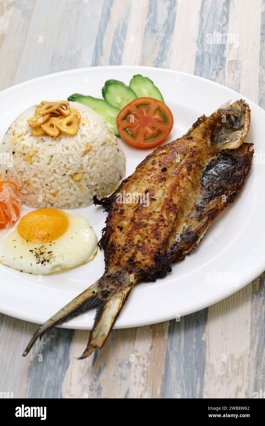 Bangsilog (milkfish, fried rice, and egg), traditional Filipino breakfast Stock Photo