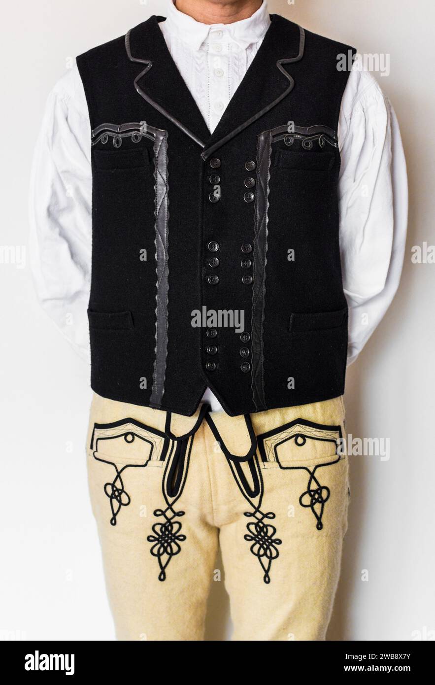 Traditional Szekler Folklore male wear, outfit, featuring a button-up vest and tailored pants, complete with a sharp collar and functional pockets Stock Photo