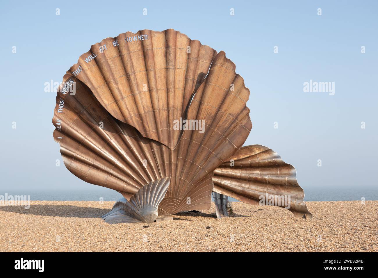 The Scallop, on the beach at Aldeburgh, Suffolk, England UK. A stainless steel by Suffolk-based artist Maggi Hambling, it stands 15 feet (4.6 m) high, Stock Photo