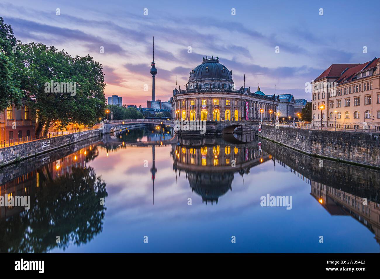 Historical buildings on Museum Island in Berlin in the morning at sunrise. River Spree with reflections. Television tower in the background of the sky Stock Photo