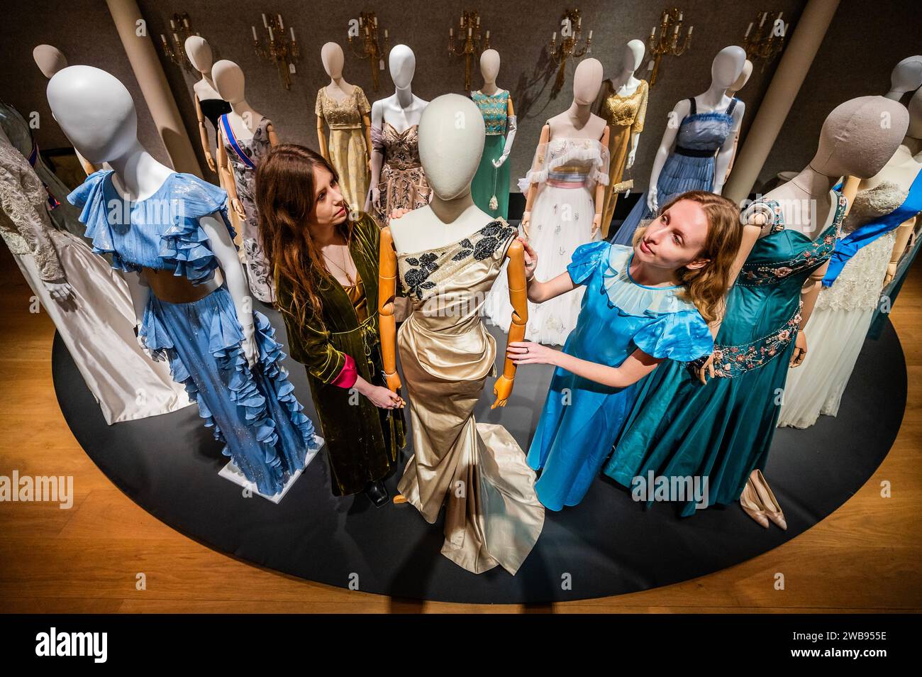 London, UK. 9 Jan 2024. Some of the many dresses including a Full-length teal ballgown, featured in the promotional poster ( © Netflix 2020, Inc.) worn by ClareFoy in Season 2 Episode 1 and Episode 4. Estimate: £3,000-5,000 and one worn by Lia Williams (as Wallis Simpson): A full-length column ballgown in Season 1, Episode 5, 'Smoke and Mirrors', £1,500 - £2,000 - A preview of The Crown Auction at Bonhams New Bond Street, London. More than 450 costumes, sets, and props from the award-winning series The Crown, a Netflix show. Credit: Guy Bell/Alamy Live News Stock Photo