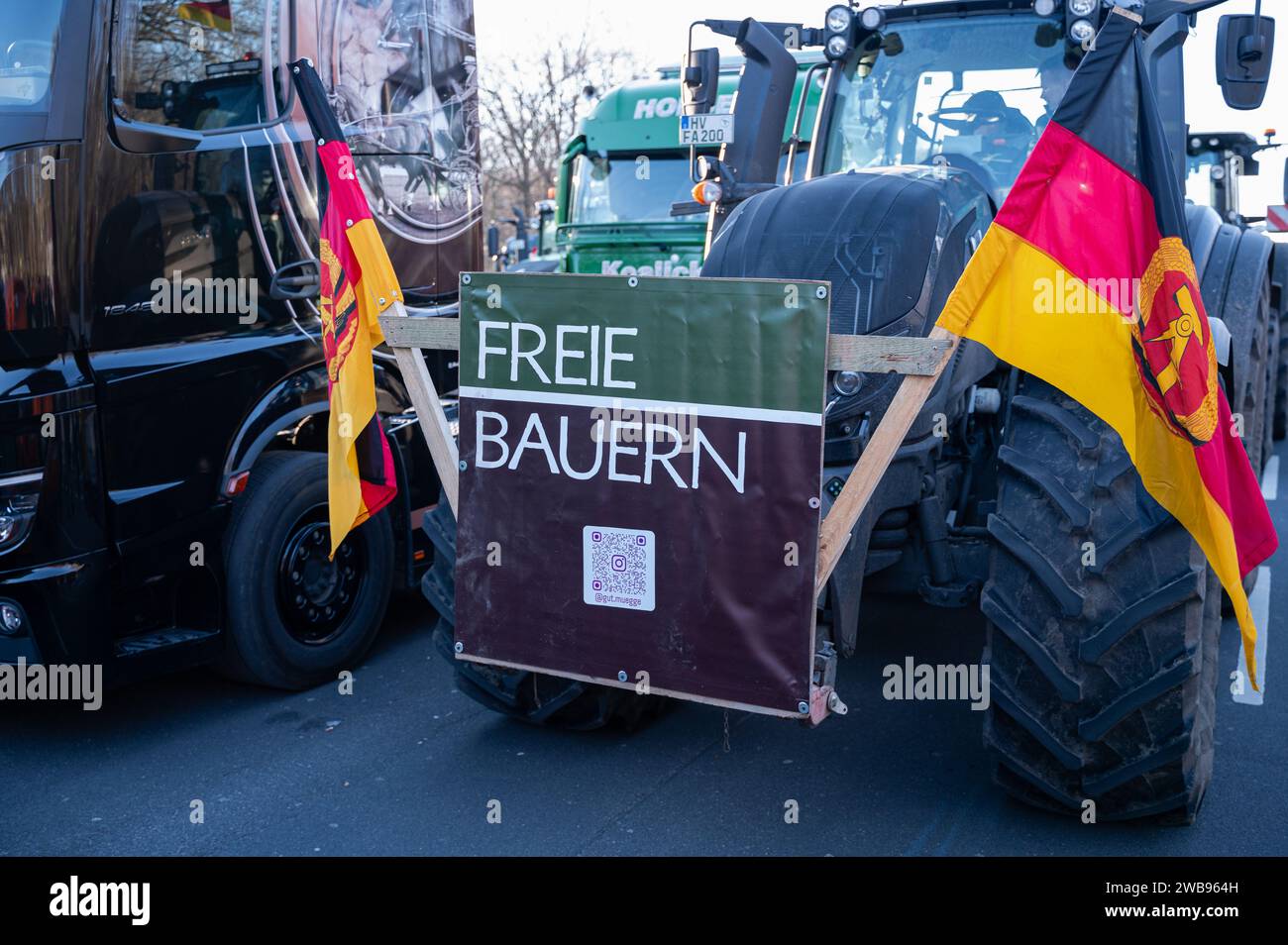 08.01.2024, Berlin, Germany, Europe - Farmers and craftsmen participate with tractors and trucks in a protest of the Free Farmers association. Stock Photo