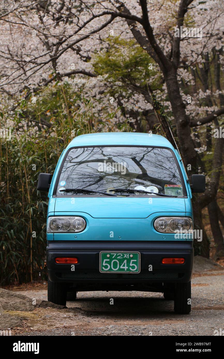 BUSAN, SOUTH KOREA - MARCH 30, 2023: Daewoo Damas kei van parked in nature area near Busan. Daewoo Damas is based on popular Suzuki Carry kei truck pl Stock Photo