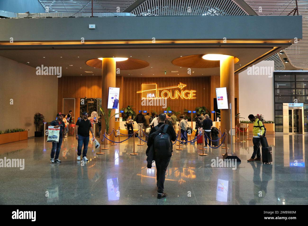 ISTANBUL, TURKEY - APRIL 11, 2023: Passengers visit IGA Lounge at Istanbul Airport, one of busiest airports in the world. Stock Photo
