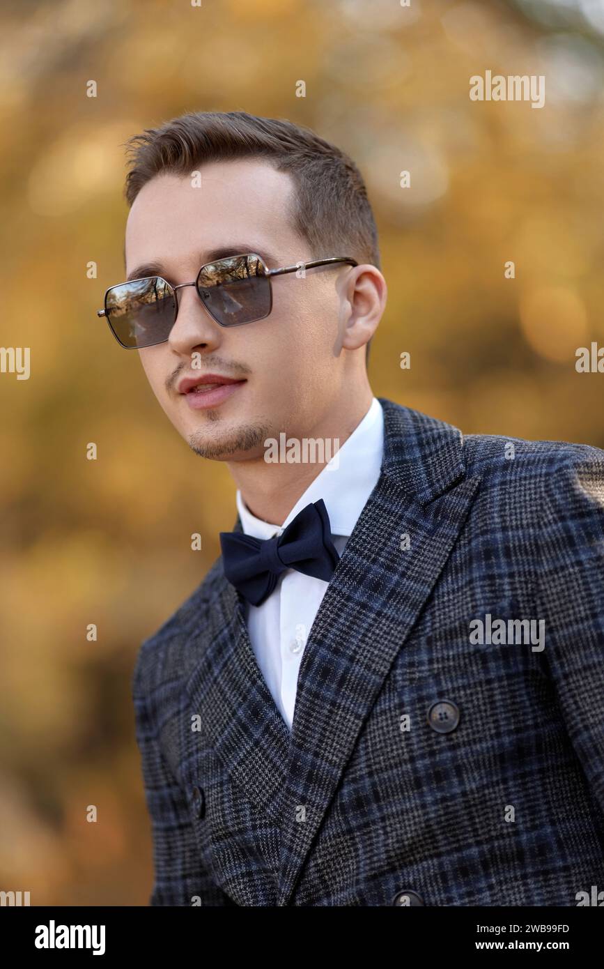 Handsome young man in classic checked suit and sunglasses outdoor Stock ...