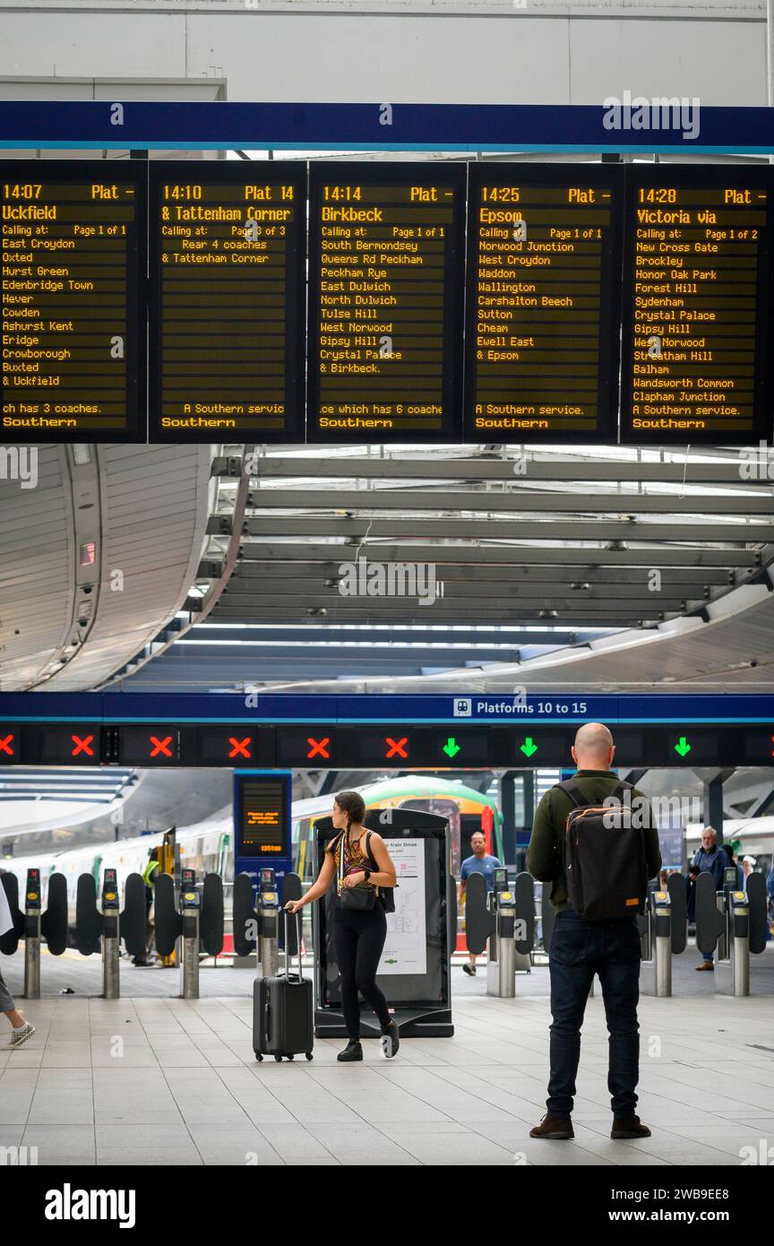 Digital destination display on a railway station concourse, London Bridge Station, London, England. Stock Photo
