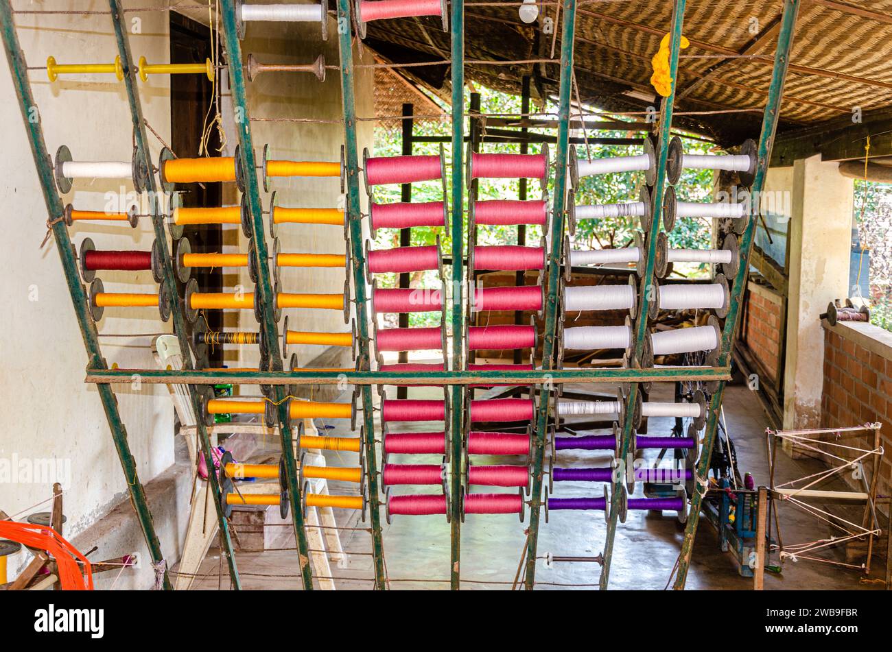 Cotton yarn spindles used for weaving on a traditional wooden handloom