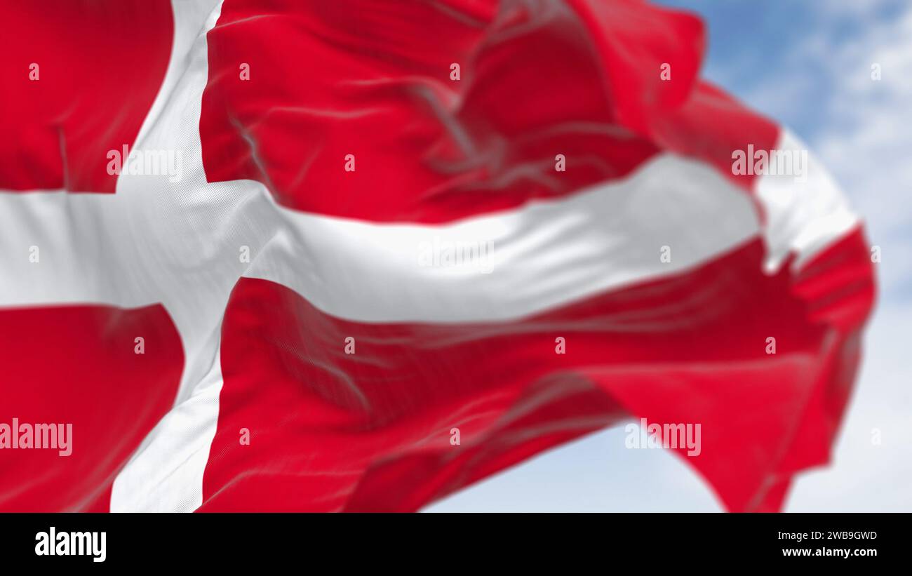 Close-up of Denmark national flag waving on a clear day. Red flag with a white Scandinavian cross extending to the edge of the flag. 3d illustration r Stock Photo
